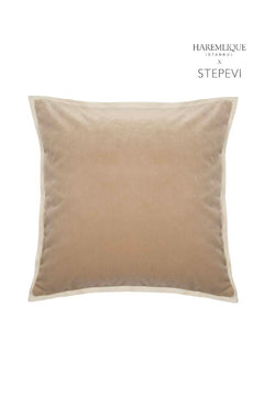 Camel velvet cushion with cream piping detail. HAREMLIQUE ISTANBUL x STEPEVI branding displayed. Elegant home decor accent.