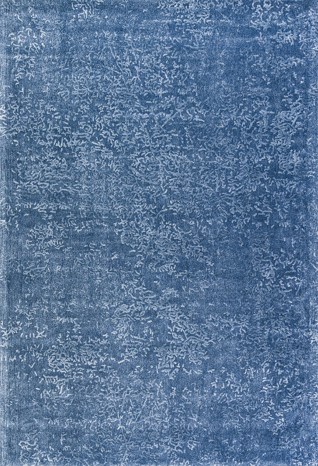 Close-up of the Blossom - Lagoon Blue rug. The abstract floral design adds a soft, subtle pattern to any space. thumbnail_1