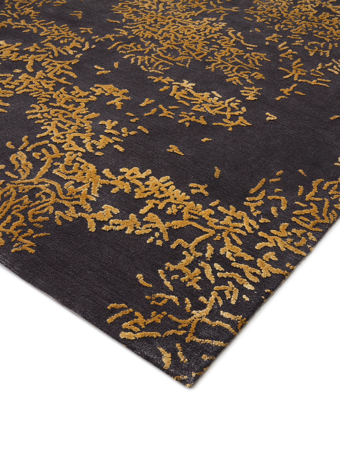 Abstract rug detail: A stylish Titanium Gray rug with a unique, dark gold blossom-like pattern, showcasing texture and thumbnail_1