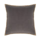Gray velvet cushion with camel-colored piping detail. Decorative pillow for sofa, bedroom, or living room accent.
