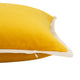 Close-up of the yellow velvet cushion, showcasing the cream-colored piping detail and texture. Throw pillow cover.