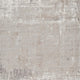 Textured area rug in neutral tones; soft grey and beige abstract design for living room or bedroom decor.