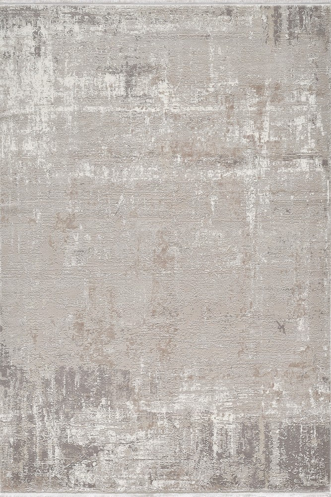 Textured area rug in neutral tones; soft grey and beige abstract design for living room or bedroom decor.