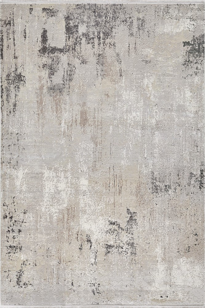 Textured rug featuring abstract patterns in muted tones, offering a modern and sophisticated aesthetic.