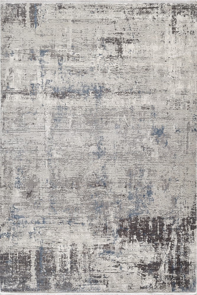 Close-up of Zenith area rug showcasing its textured, abstract design with shades of gray, blue, and brown for a modern