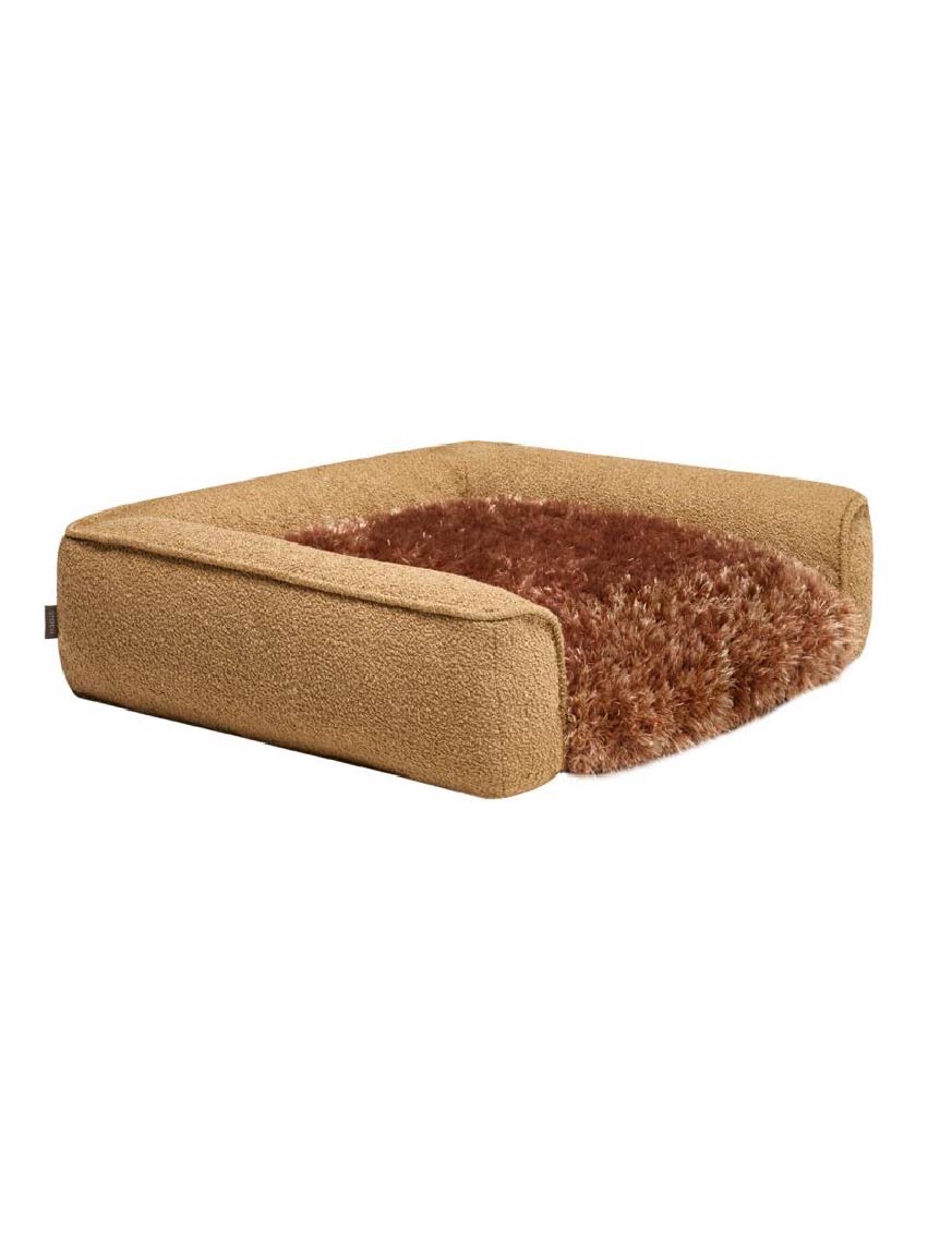 Brown pet bed with fluffy interior on a white background