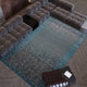 Sectional sofa with a blue rug in a living room setting thumbnail_2