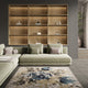 Living room showcasing the 'Pixel Rose - Cliff' rug with its abstract design and muted colors, complementing the modern 